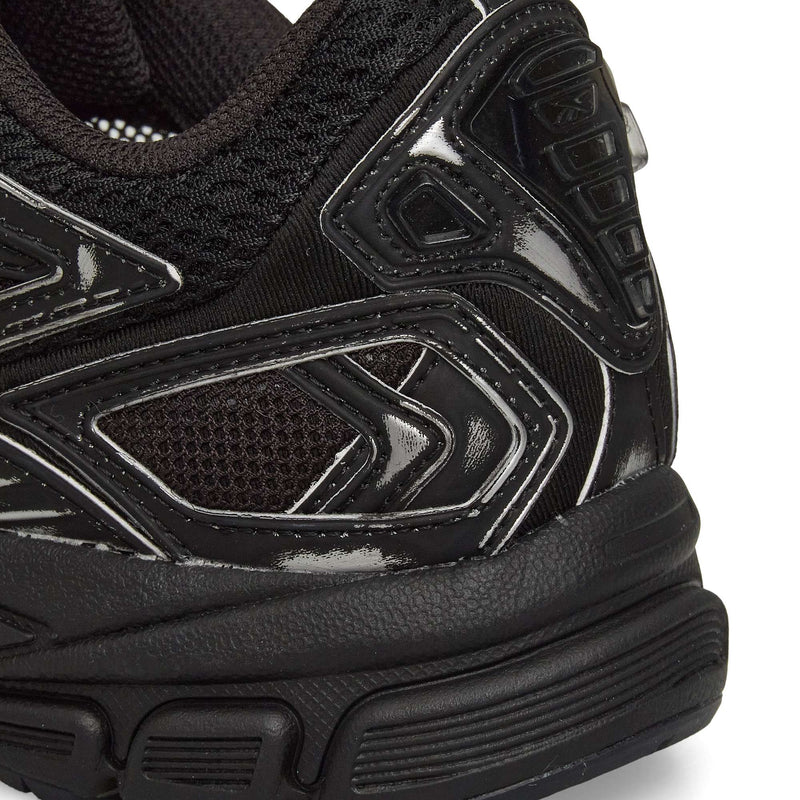 Close-up of the heel and side of Reebok Premier Road Ultra Shoes, highlighting textured mesh, glossy synthetic overlays, detailed stitching, and the dual-density midsole.