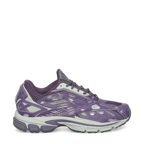 The Reebok Premier Road Ultra Shoes in purple feature white accents, mesh panels, and a thick light gray dual-density midsole, displayed in side profile against a white background.