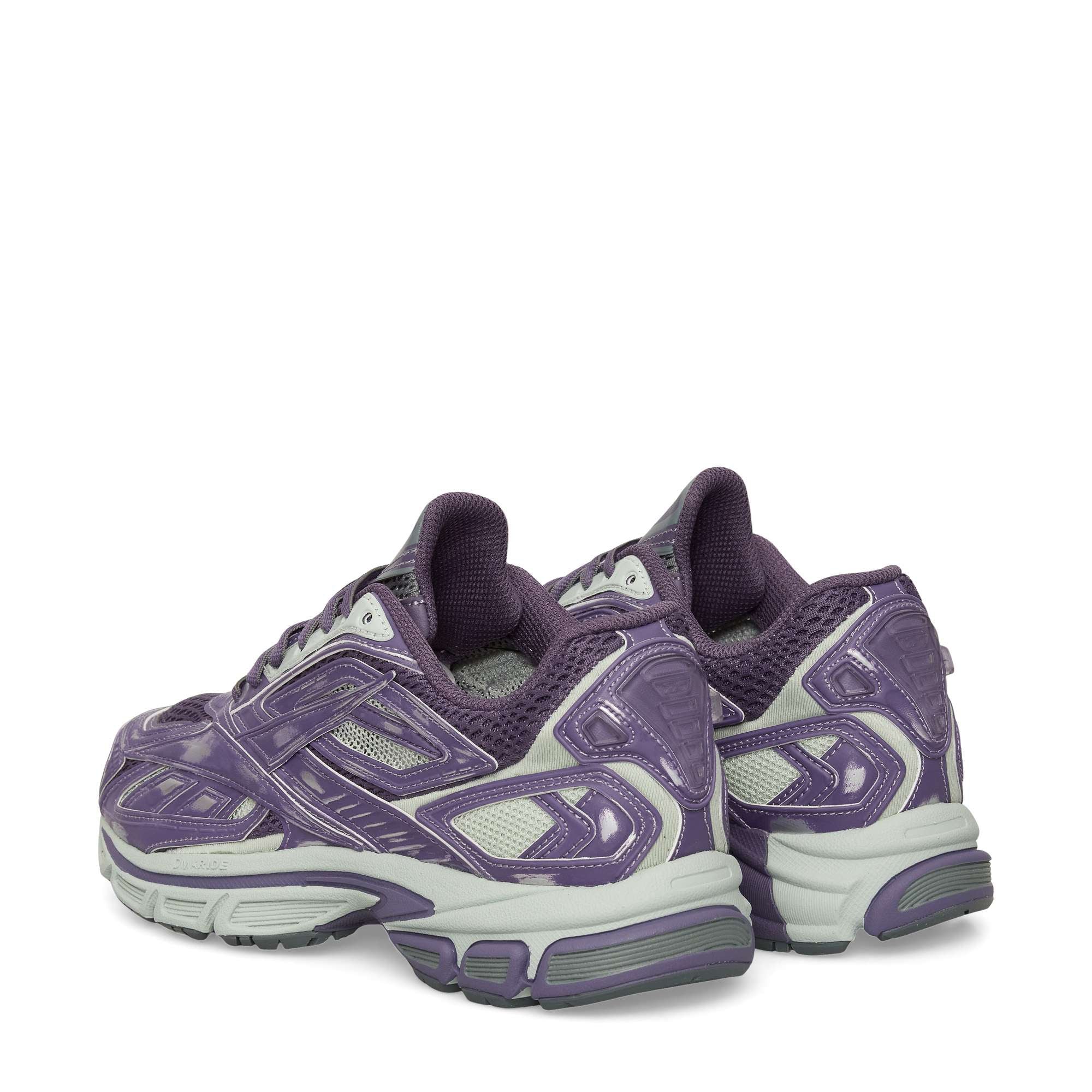 The Reebok Premier Road Ultra Shoes are purple and gray running sneakers with mesh and synthetic overlays, chunky soles, and a dual-density midsole for comfort, shown from the rear and slightly to the side.