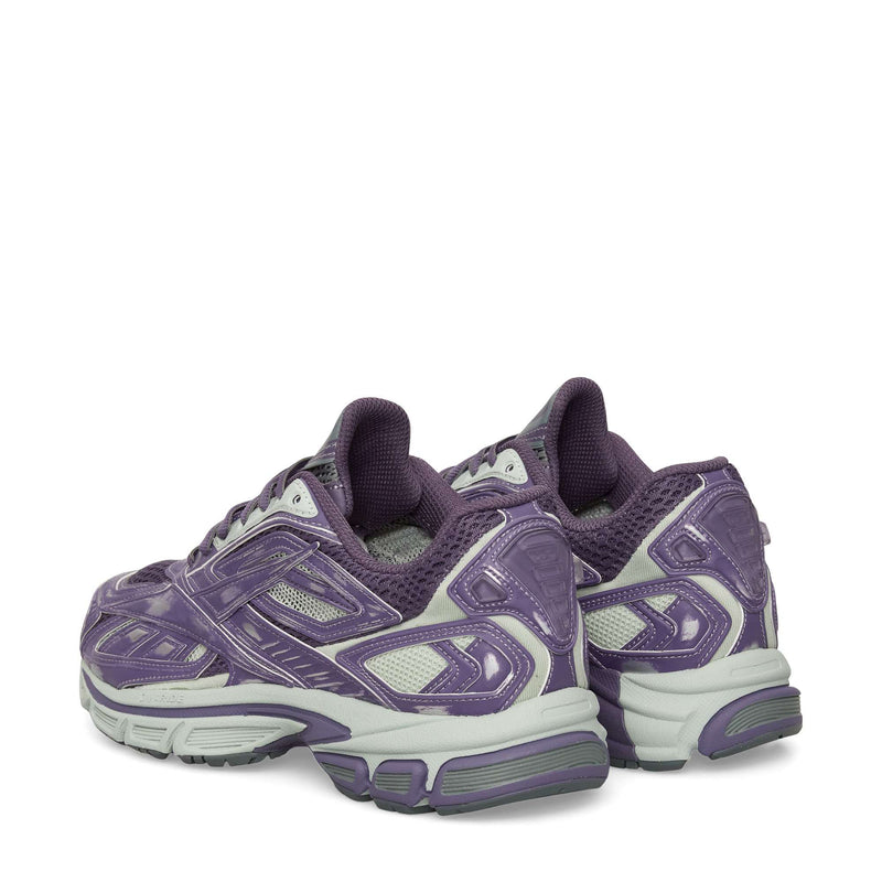 The Reebok Premier Road Ultra Shoes are purple and gray running sneakers with mesh and synthetic overlays, chunky soles, and a dual-density midsole for comfort, shown from the rear and slightly to the side.