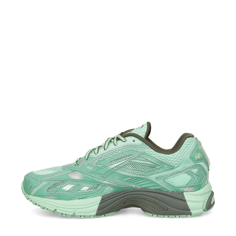 The Reebok Premier Road Ultra Shoes are mint green running sneakers with dark green accents, mesh and synthetic overlays, a dual-density midsole, textured sole, and lace-up closure, shown in profile against a white background.