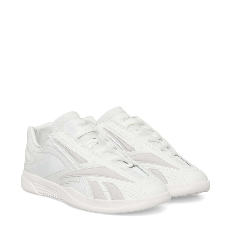 A pair of Reebok Hammer Pro LTD Shoes in white faux leather with a sleek low-top design, subtle textured patterns, and durable rubber soles, displayed side by side on a white background.