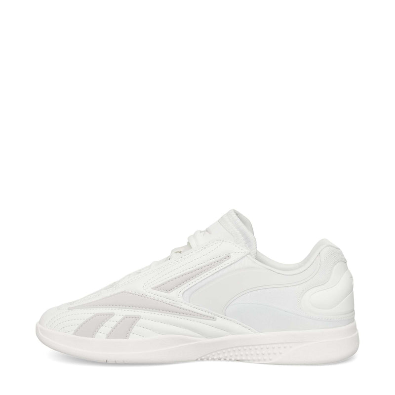 A white Reebok Hammer Pro LTD Shoe with light gray accents, a durable rubber sole, lace-up closure, and smooth faux leather panels, shown from the side on a plain white background.