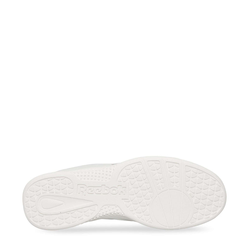 The image displays the bottom of a white Reebok Hammer Pro LTD Shoes sole, highlighting its textured grip patterns, durable rubber construction, and an embossed Reebok logo near the center.