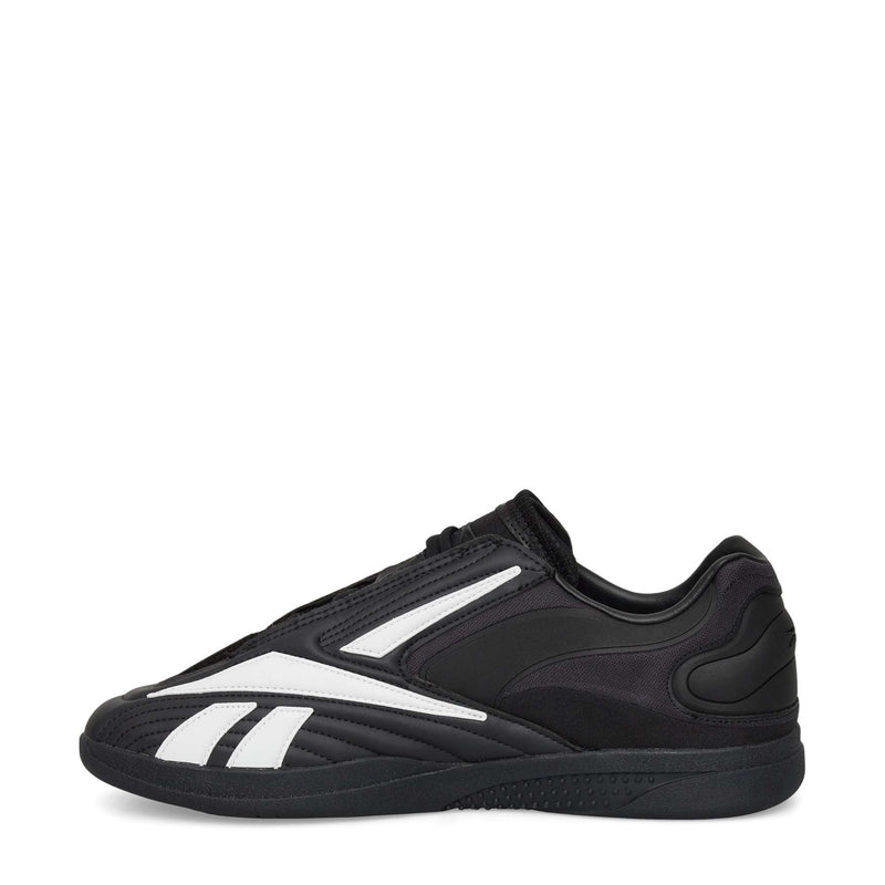 Reebok Hammer Pro LTD Shoes are black low-profile athletic sneakers with white geometric accents, a durable rubber sole, minimal branding, and precise stitching for a sleek, modern look.