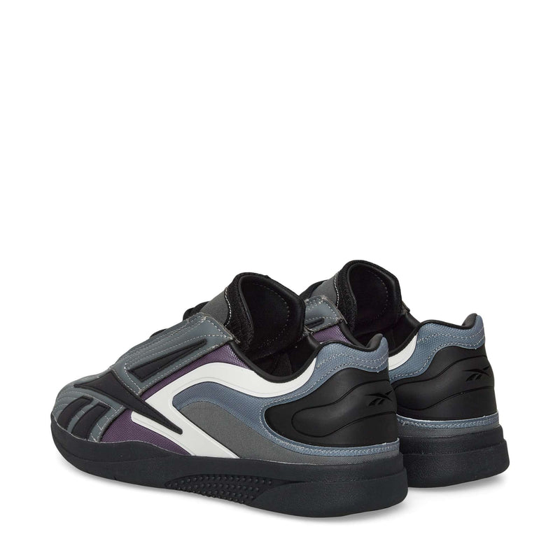Reebok Hammer Pro LTD Shoes in grey, black, purple, and white faux leather feature layered panels. Styled heels forward to highlight the back and side details.