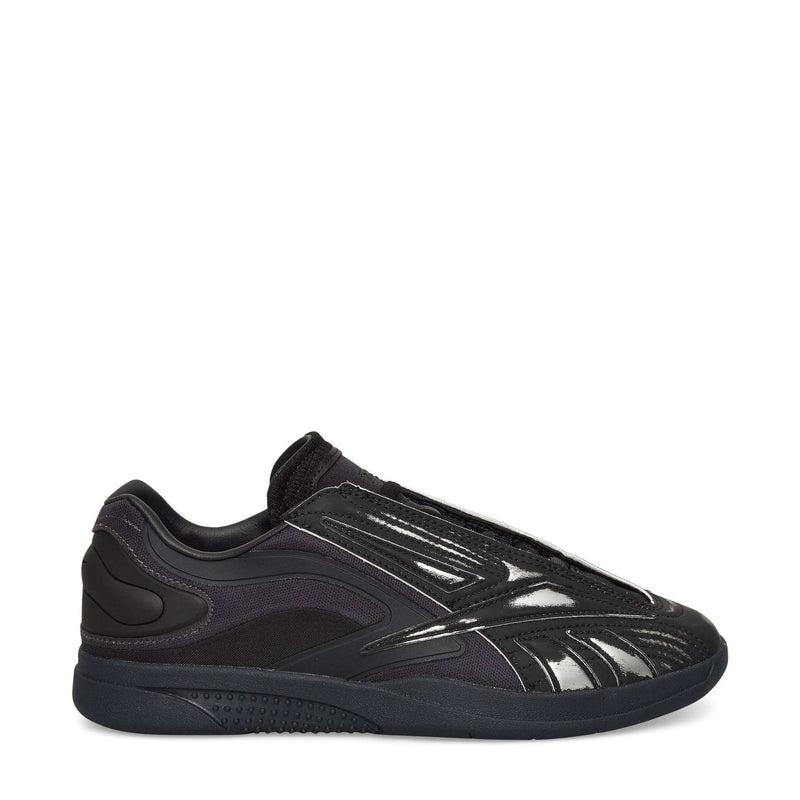 A black Reebok Hammer Pro LTD Shoe with a glossy, textured faux leather upper, mesh and synthetic overlays, and a durable rubber sole, shown in side profile on a white background.