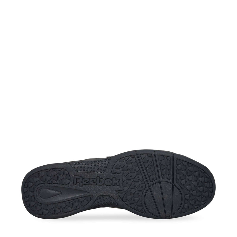 The image displays the black, durable rubber sole of the Reebok Hammer Pro LTD Shoes, showcasing textured grip patterns and a molded Reebok logo in the center.