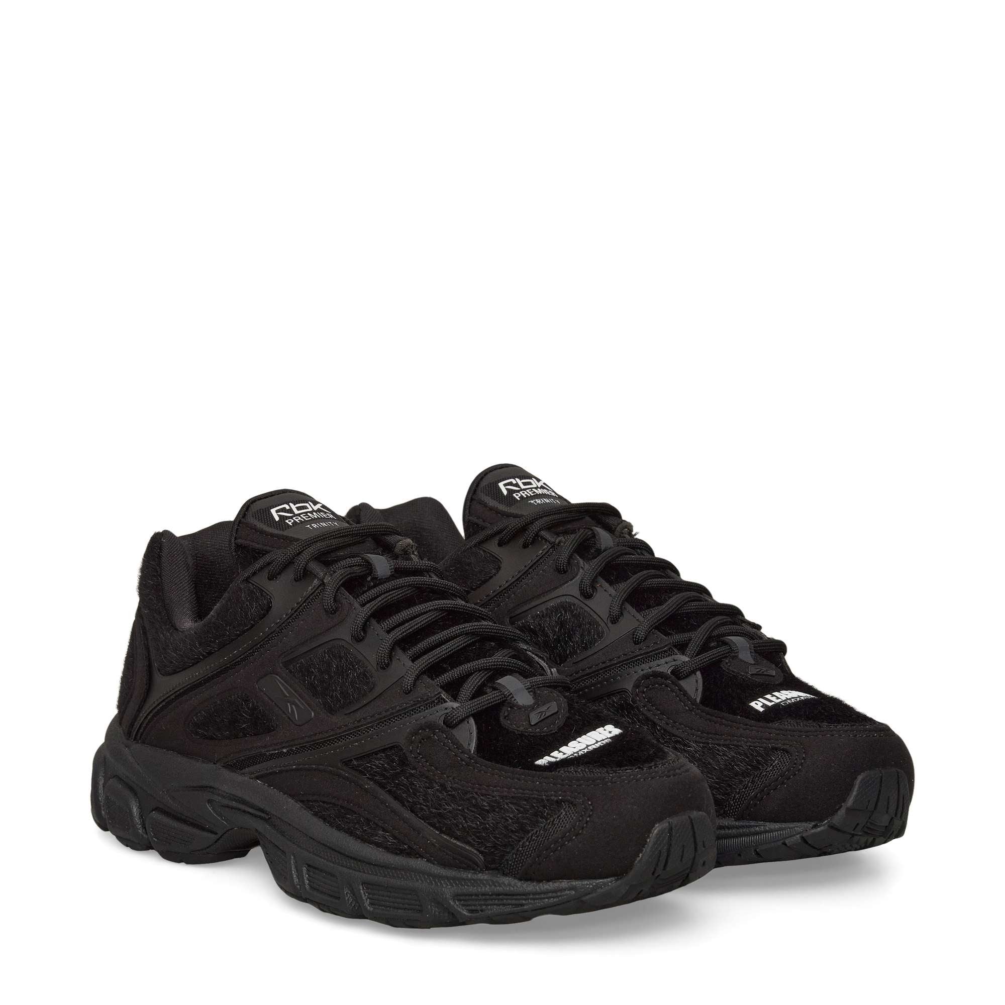 A pair of black athletic sneakers with textured mesh and suede panels, thick rubber soles, and Potential branding on the tongue and toe area. The shoes are positioned side by side on a white background.