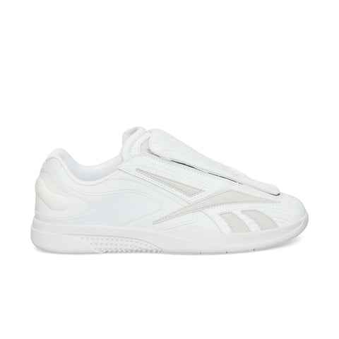 The Reebok Hammer Pro Ltd is a white low-profile sneaker with a smooth and perforated design, layered details, a lace flap, a suede upper, and a durable rubber sole for grip.