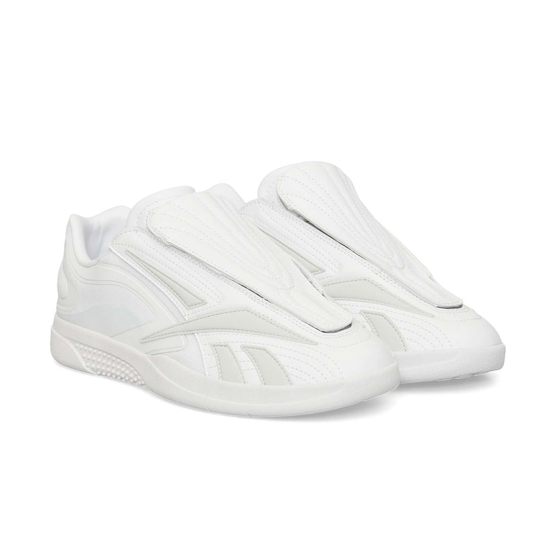 A pair of Reebok Hammer Pro Ltd sneakers, all white with a modern suede upper, closed tongue, and durable rubber sole, are pictured side by side against a white background.