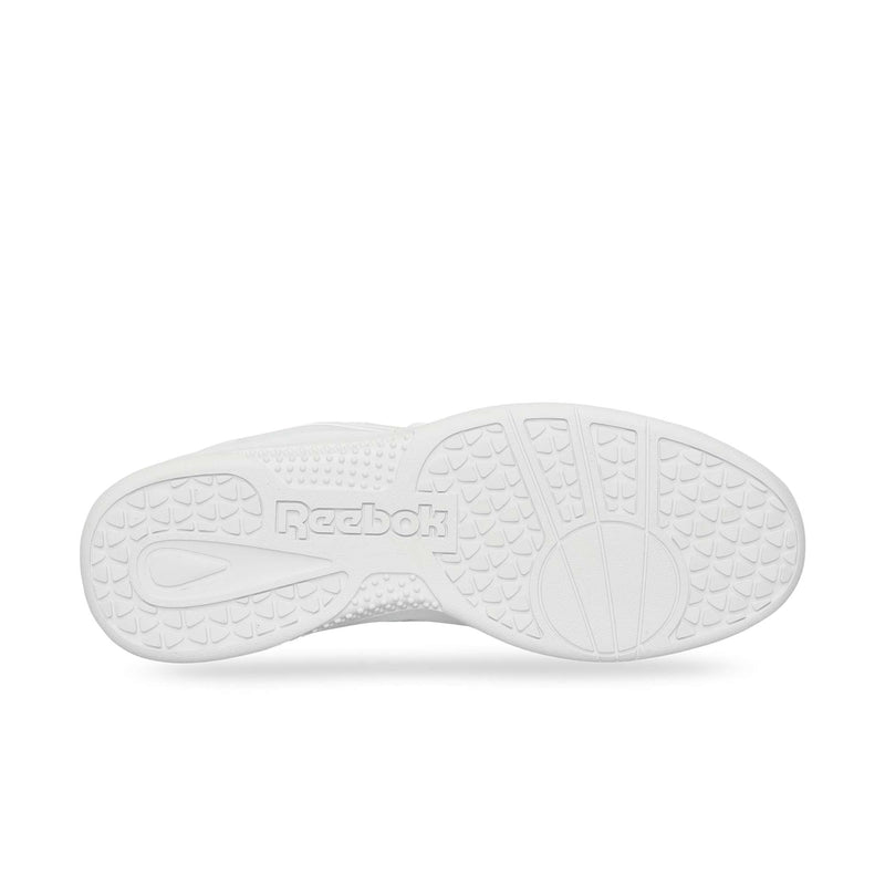 The image shows the white rubber sole of the Reebok Hammer Pro Ltd, viewed from below. It features textured grip patterns and an embossed Reebok logo in the center for durability and traction.