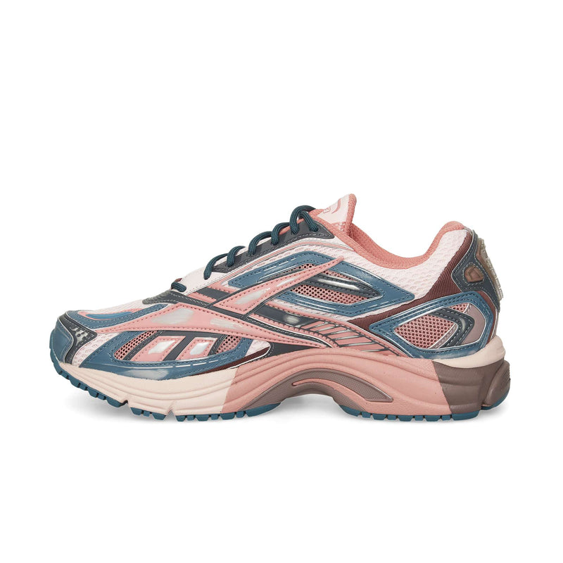 The Reebok Premier Road Ultra is a stylish athletic sneaker inspired by archival runners, featuring pink, blue, and white mesh with synthetic overlays, shown in side profile against a white background.