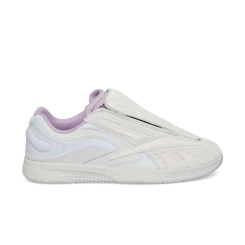 A white and light gray Reebok Hammer Pro Ltd sneaker with a suede upper, lavender lining, sleek design, and subtle textured details, displayed in profile on a plain white background.