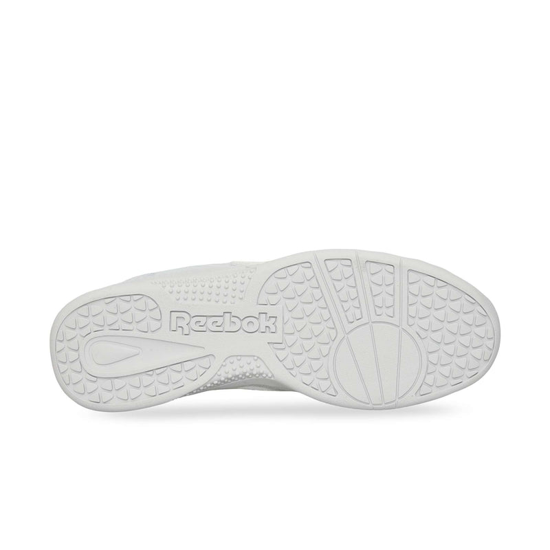 The image displays the bottom sole of the white Reebok Hammer Pro Ltd sneaker, showcasing textured grip patterns and "Reebok" embossed in the center on its sturdy rubber sole.