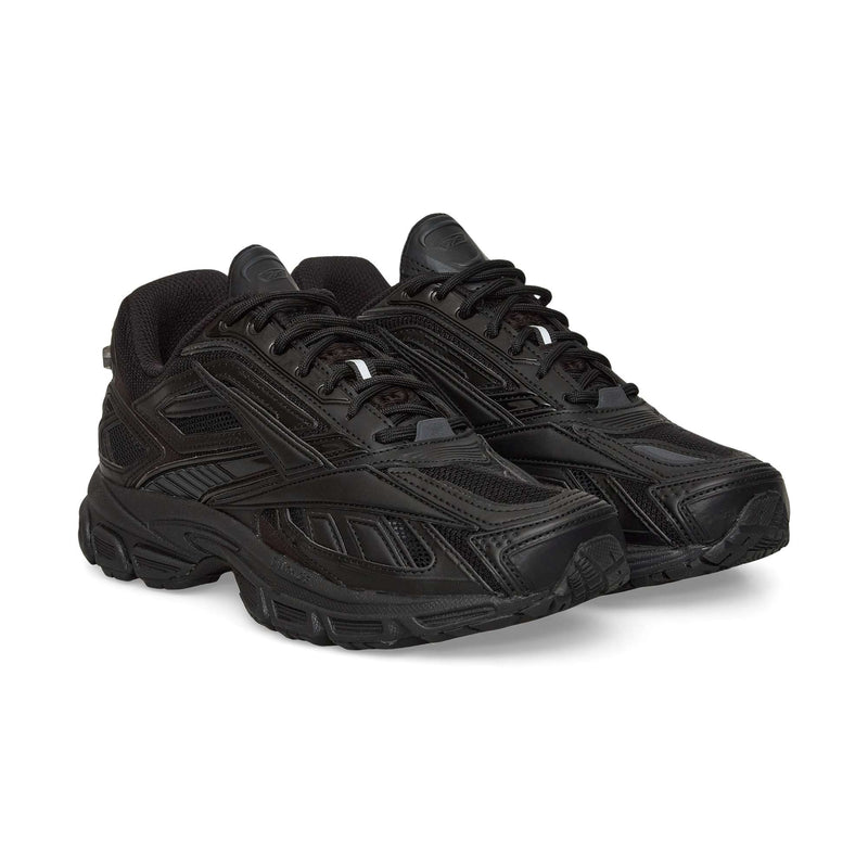 A pair of Reebok Premier Road Ultra black running sneakers with mesh and synthetic uppers, textured soles, dual-density midsoles, and black laces, positioned side by side facing slightly to the right.