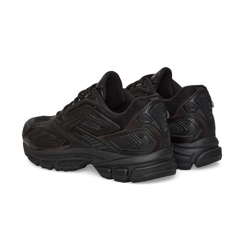 A pair of black Reebok Premier Road Ultra sneakers with textured details, seen from the back and side, featuring dual-density midsoles, thick soles, and padded collars.