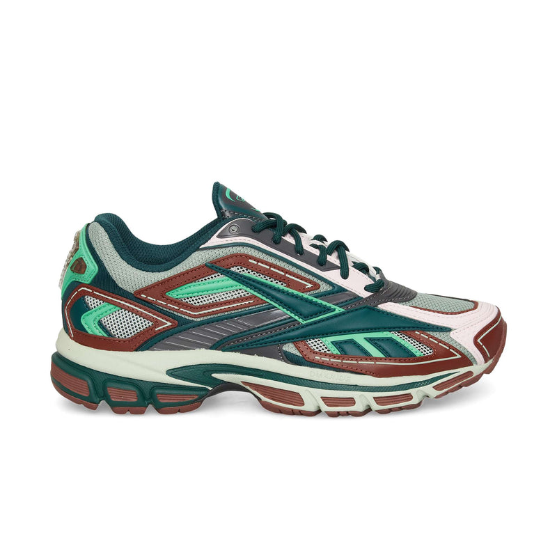 The Reebok Premier Road Ultra is a multicolored running sneaker in green, teal, maroon, white, and gray with a mesh upper, layered synthetic overlays, cushioned sole, and dual-density midsole for enhanced comfort.