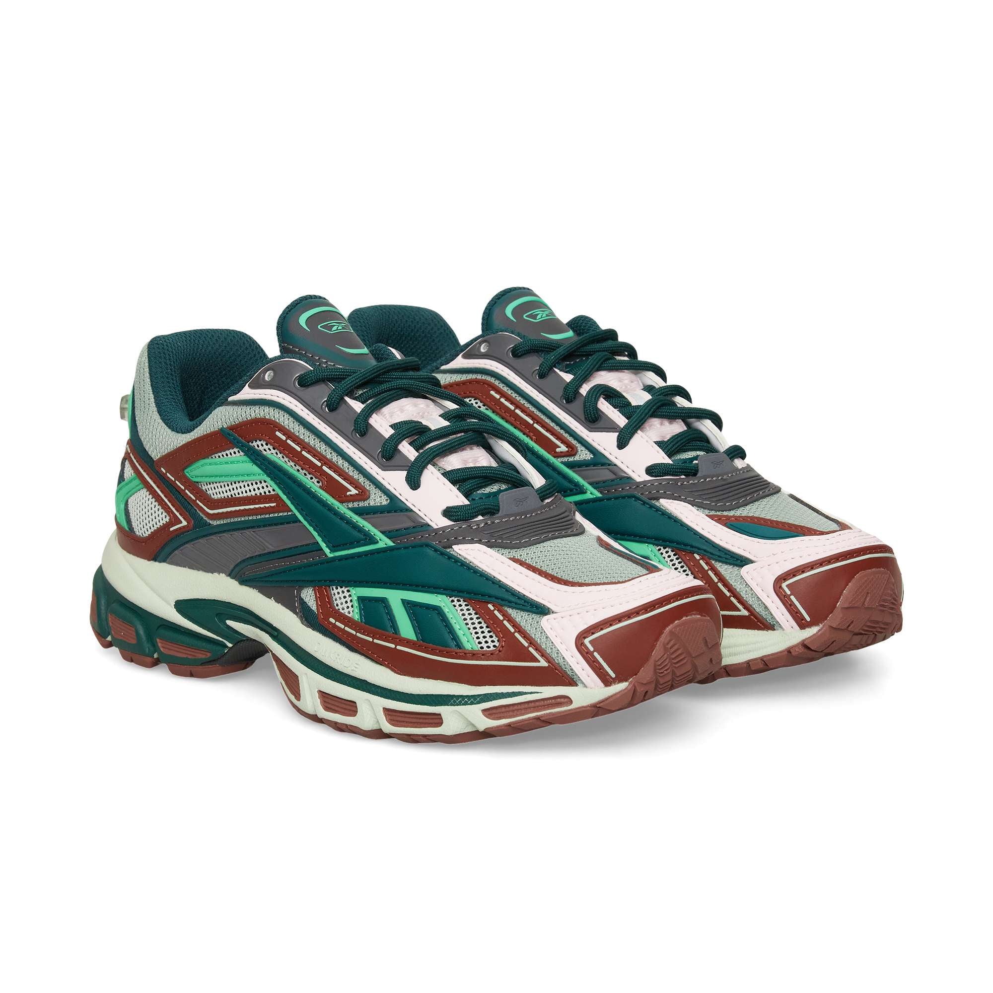 The Reebok Premier Road Ultra features a chunky sole, breathable mesh panels, and a bold mix of teal, green, red, white, and dark gray—perfect as a stylish athletic sneaker.
