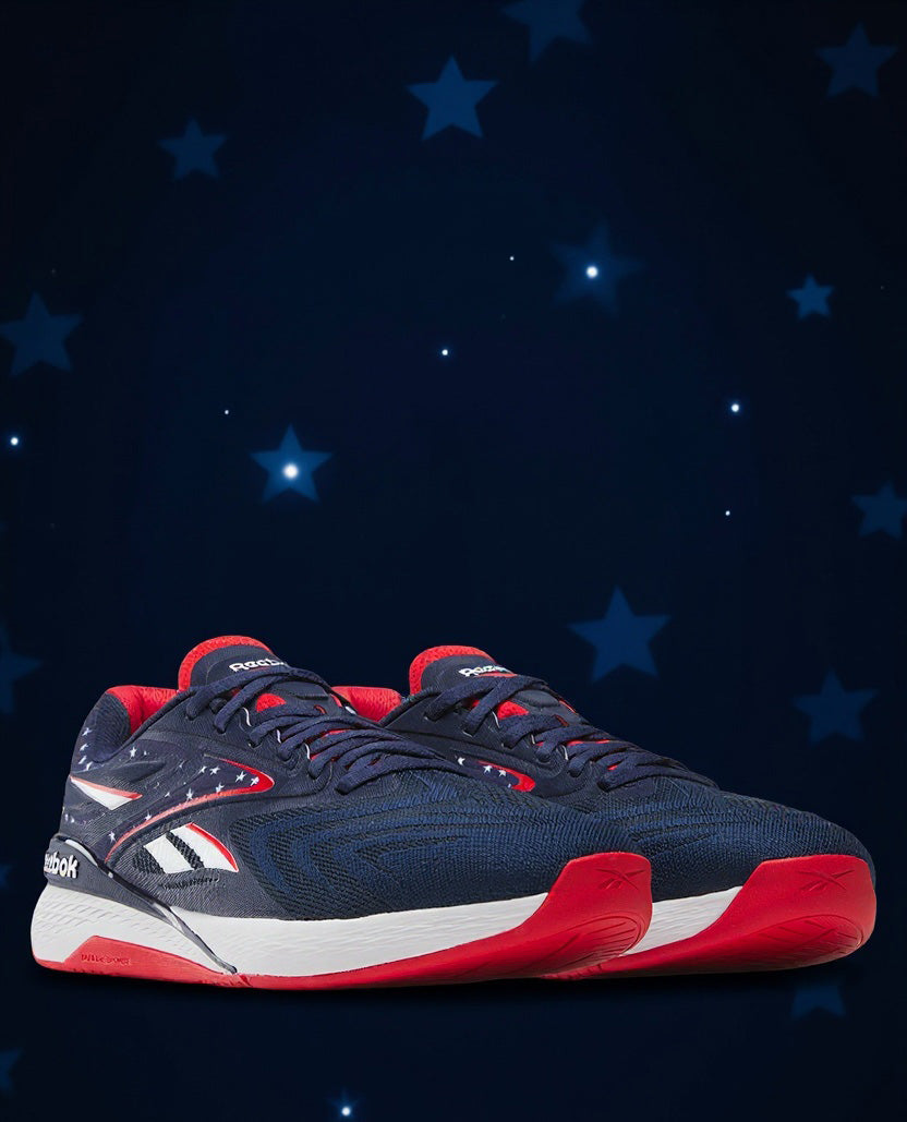 Navy and red athletic shoe on a dark blue background with stars